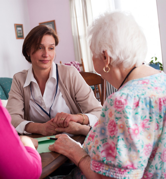 transition coach and patient sitting at table