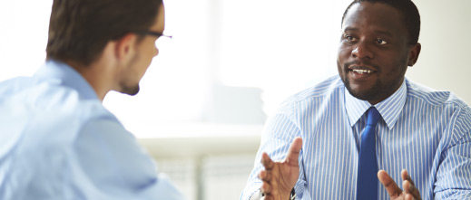 two-young-professional-men-having-a-meeting two young professional men having a meeting
